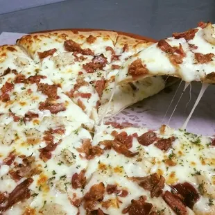 a slice taken out of the pizza
