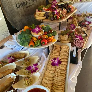 Charcuterie Board with veggies, siu mai, veggie egg rolls, and lumpia shanghai