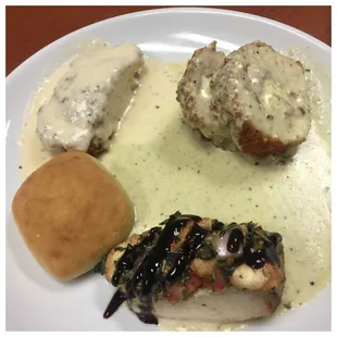 The roll was the only edible thing on this plate.  The chicken on the bottom might have passed were it not for the giant bone.