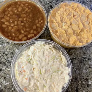 Side of baked beans, potato salad, coleslaw