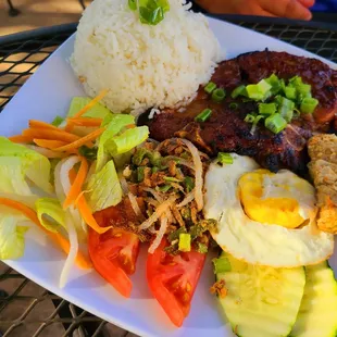 Pork Chop, pork skin and fried egg