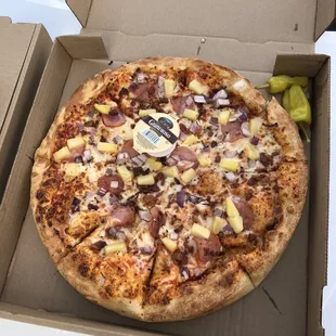 a pizza in a cardboard box
