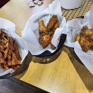 From right to left: sweet potato fries, Old Bay wings, Garlic Parmesan wings