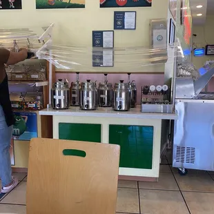 a woman standing in front of a counter