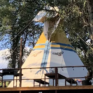 Giant Tipi with large deck 2 queen beds and claw foot bathtub