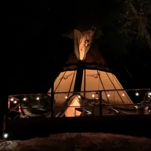 26' Tipi with huge deck by night