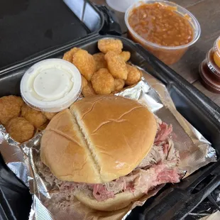 Jumbo pulled pork sandwich Baked Beans Corn Nuggets