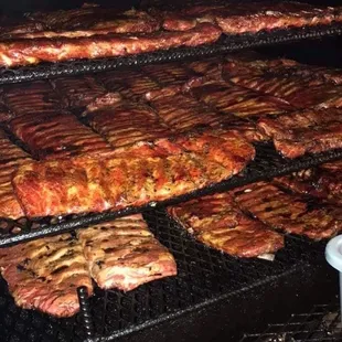 meat being cooked on a grill