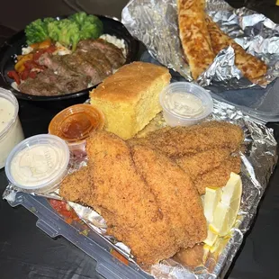 Catfish dinner, with mac n cheese collards and spaghetti underneath- like damn!