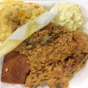 Fried pork chop with mac &amp; cheese, potato salad and cornbread... All for $8