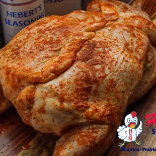 a whole chicken on a cutting board