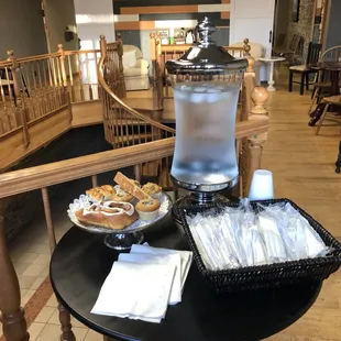 a table with a beverage dispenser