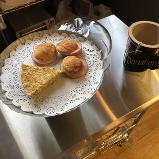 a plate of pastries and a cup of coffee