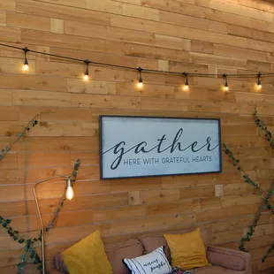 wood paneled wall with string lights