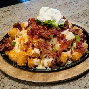 Loaded Tots appetizer - highly recommend! More than enough for two.