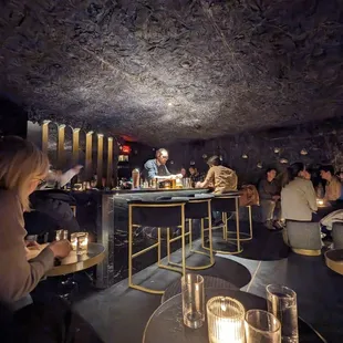 a group of people sitting at a bar