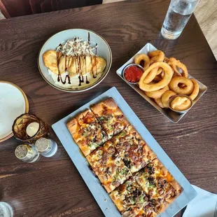 Flatbread, pierogi, and onion rings