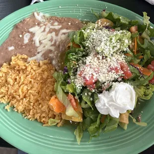 Flautas, kinda buried under some greens