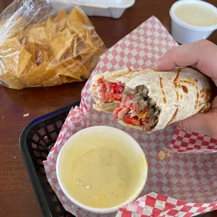 Hot Cheetos burrito with chips and queso