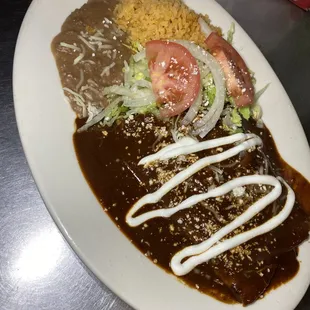 Enchiladas de mole with rice and beans
Choose from chicken, beef or cheese