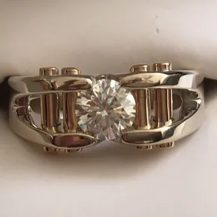 Purchased the ring from his stock and then the stone separately after-which he set the diamond.