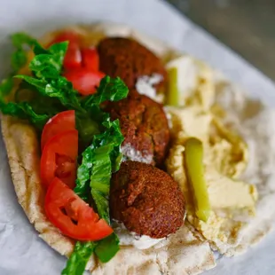 a pita with meat and vegetables