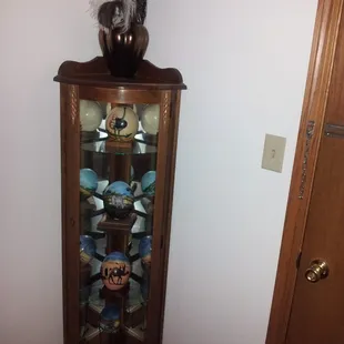 Curio Cabinet with Hand Painted Ostrich Eggs.
