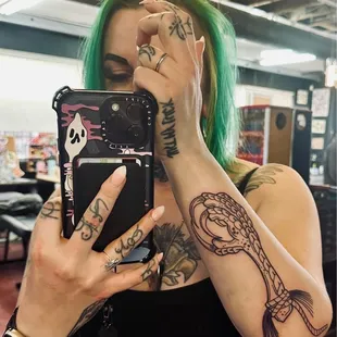 Chicken foot talisman forearm tattoo -- by Rick Keene