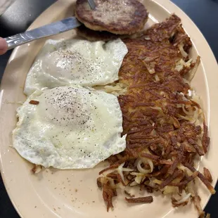 Eggs over easy, sausage patty, and super crispy and perfectly seasoned hash browns