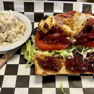 HUMBOLDT FOG MELT: ham topped with Humboldt Fog cheese, with honey dijon mustard, Fig jam, lettuce &amp; tomato, on a fresh toasted baguette.