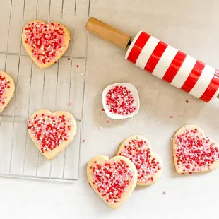 heart shaped sugar cookies on a cooling rack