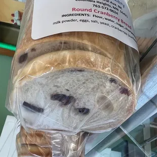 a loaf of bread wrapped in plastic