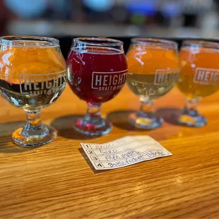 three glasses of beer and a ticket