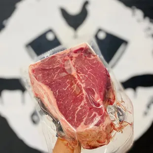 a piece of meat wrapped in plastic