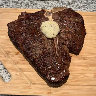 24 oz Porterhouse with homemade garlic butter, cooked medium rare.