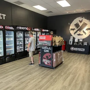 Meats located on left side of store in the fridge/freezer areas.