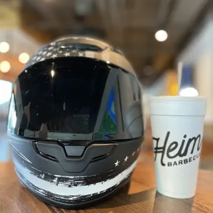 a helmet and a cup of coffee