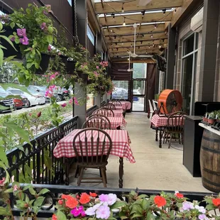 Such a cute patio, surrounded by hanging plants!  (6/18/2022)