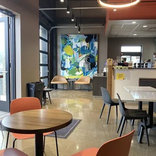 Shot of the pick up area with seating and garage door