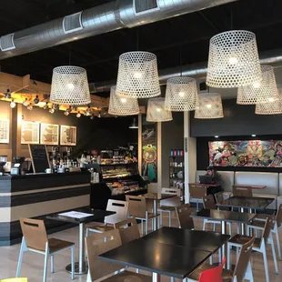 Another section of coffee shop with cool ceiling lighting.