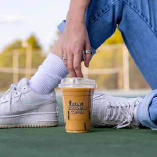 a person holding a cup of coffee