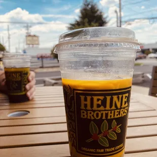 An iced oat milk latte for me  and a cold brew for him please