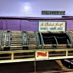 a barrel of wine on a cart