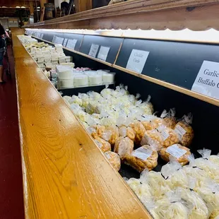 a display of cheeses and pastries