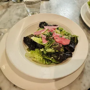 a salad on a white plate