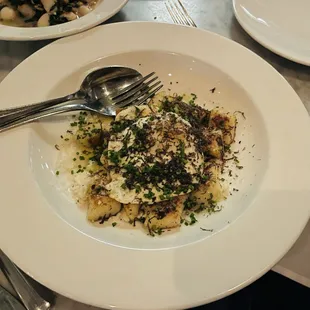 a plate of pasta and a fork