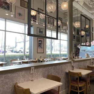 a dining area with tables and chairs