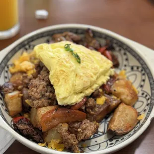 Breakfast skillet with scrambled eggs and sausage.