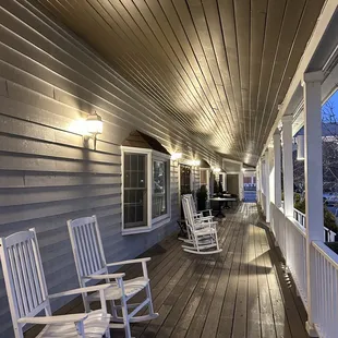 a porch with rocking chairs
