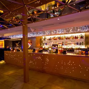 The bar shot up by bullets fitting with the HEIST theme.